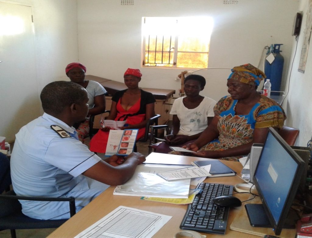 Photo of women receiving health education prior to their VIAC exam at Karanda Mission Hospital.